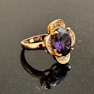 Gold-Tone Ring with Purple Oval Gemstone and Pavé Accents